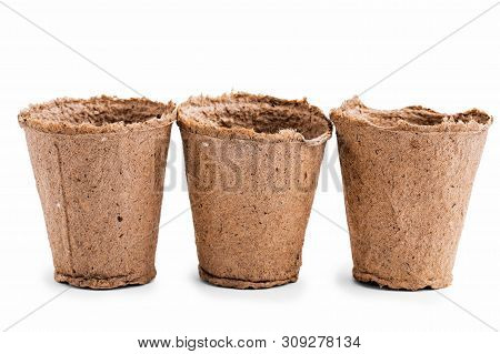 Pots For Seedlings Of Ecological Cardboard. Peat Seed Pots. Pots On Isolated White Background