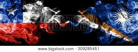 Chile Vs Marshall Islands Smoky Mystic Flags Placed Side By Side. Thick Colored Silky Smokes Combina
