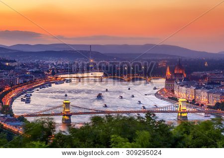 Budapest Panorama With Parliament And Bridges During Evening Twilight Sunset. View From Citadel