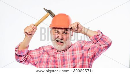 Man Bearded Laborer Wear Helmet Hold Hammer. Repair Workshop. Repair Concept. Senior Foreman Worker.