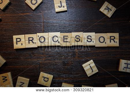 Word Or Phrase Processor Made With Scrabble Letters On Black Table.