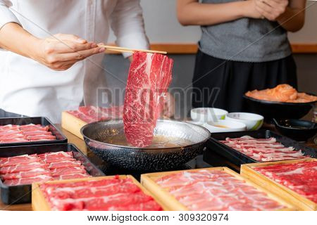 Cooking of japanese wagyu beef Shabu Shabu set hot pot