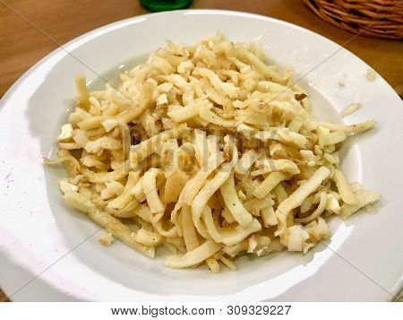 Turkish Noodle / Eriste With Cheese, Walnuts And Parsley. Traditional Food. Traditional Food.