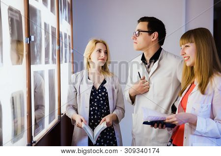 Group Of Nurse Studying The Sections Of The Brain. The Concept Of Health Education. Students In The 
