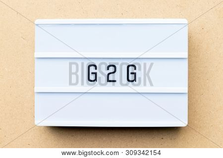 White Lightbox With Word G2g (abbreviation Of Government To Government) On Wood Background