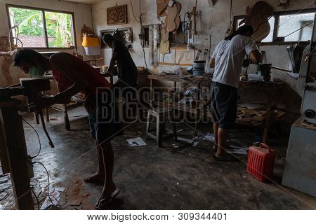 Gianyar,bali/indonesia-may 30 2019: The Guitar Craftsmen Are Working On Making Guitars In A Classica