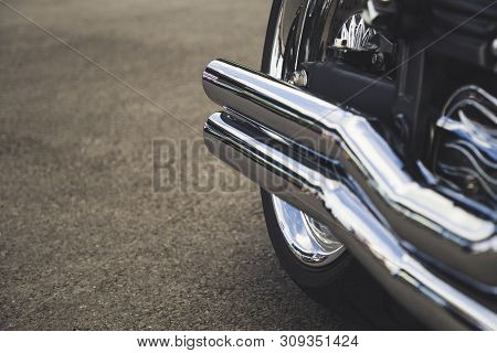 Motorcycle Exhaust Pipe. Chrome Shiny Clean Motorbike Tail-pipe. Close Up View.