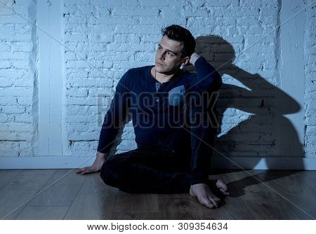 Desperate Lonely Unhappy Caucasian Man Suffering From Depression Sitting Alone On Floor At Home