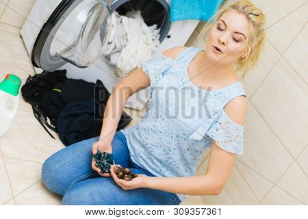 Woman Comparing Washing Laundry Nuts And Chemicals Detergent Blue Pods. Alternative Household Duties