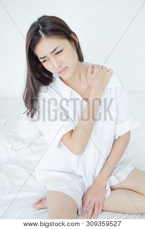 Asian women are headache severely.Lady wake up in the morning with migraine. Insomnia results in hea