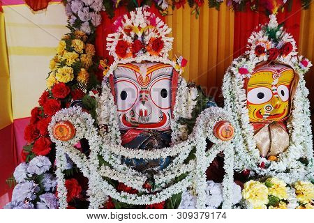 Idols Of Hindu God Balaram And Goddess Suvadra Are Being Worshipped With Garlands For Rath Jatra Fes