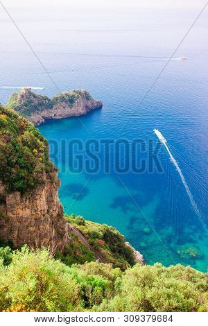 Beautiful Cozy Bay With Boats And Clear Turquoise Water In Italy