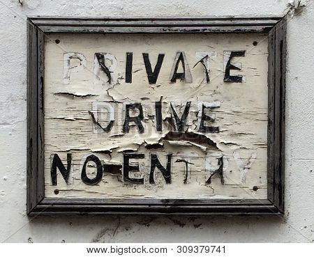 Delapidated Painted Sign With Peeling Monochrome Paint