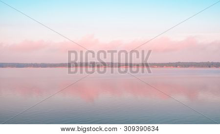 Reflection Of Pink Clouds On A Lake. Saylorville Lake, Near Polk City, Iowa, Usa. Blue Hour, Cotton 