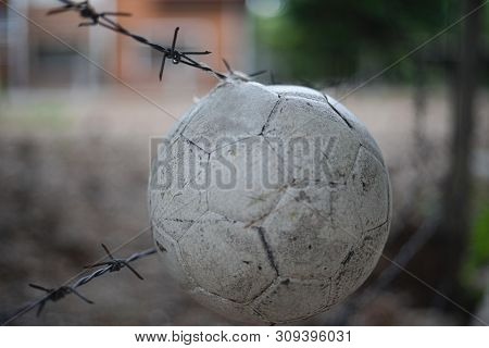 Dirty White Ball Hanging In Front Of  Abandon Place