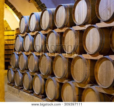 Vintage Wine Cellar With Old Oak Barrels, Production Of Fortified Dry Or Sweet Marsala Wine In Marsa
