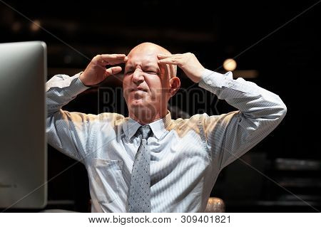Elderly Office Worker In Front Of A Computer Made A Mistake In The Calculation. Stress, Fright, Faci