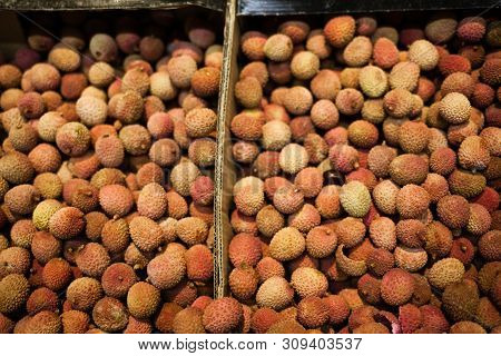 Lychee, Litchi, Lichi On Market For Fruit Pattern Background. Healthy And Vegetarian Food.