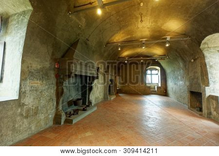 Empty hall with fireplaces in Castello di Serralunga d'Alba