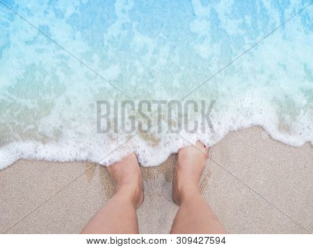 Selfie Woman Feet On Beige Sand Summer Beach Background. Holiday Vacations Concept.