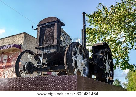 Vysokinichi, Russia - August 2018: Monument To The First Tractor Htz (kharkov Tractor Plant) In The 