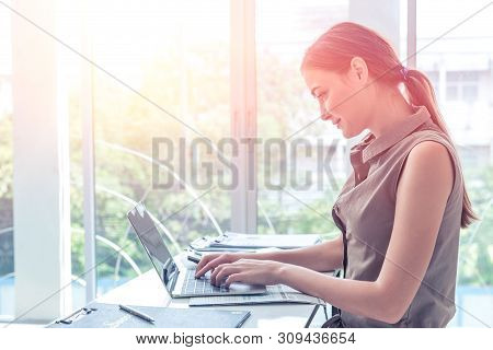 Girl Work Typing On Laptop Computer Business In Office Windows Portait Side View