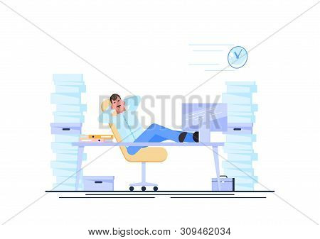 Business Man Is Resting At His Workplace Desk During Working Hours With The Piles Of Paper Document