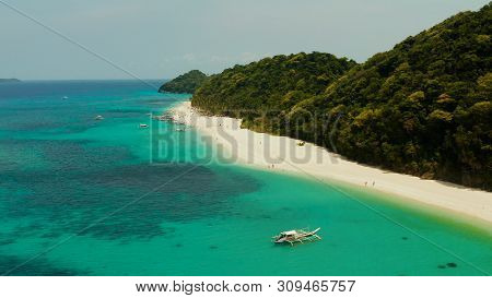 Aerial Seascape: Tropical Beach With Palm Trees And Turquoise Waters Of The Coral Reef, From Above, 