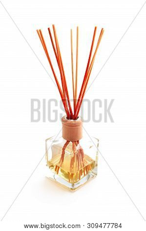 Home Perfume In A Glass Bottle With Wooden Sticks, Isolated On White Background. Elegant Spa Decorat