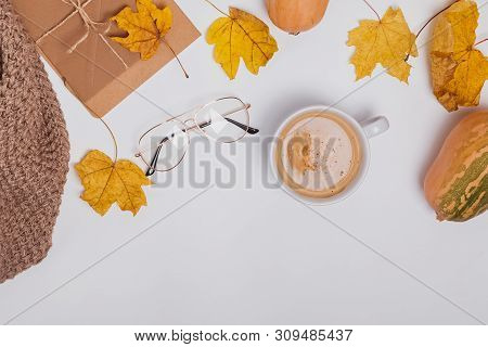 Creative Autumncomposition With Ciffee And Yellow Leaves On The White Table