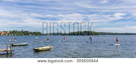 Plon, Germany - June 24, 2019: Panorama Of People Doing Standup Paddleboarding In The Lake Of Plon, 