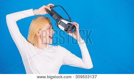 Portrait Of Young Woman Wearing Vr Goggles, Experiencing Virtual Reality Using 3d Headset. Woman Wit