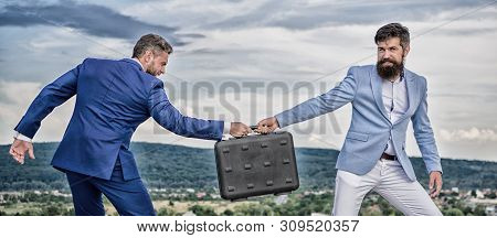 Businessman Takes Away Briefcase From Business Partner. Fraud And Extortion Concept. Man Cheating Wh