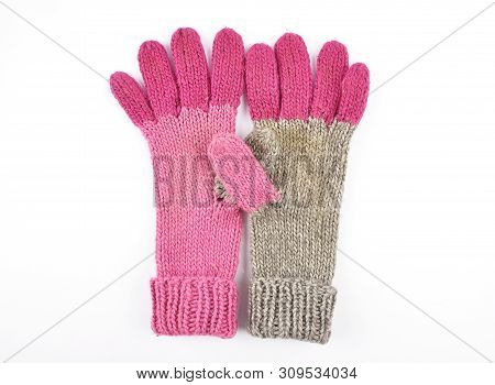 Colorful And Crisp Image Of Old Self-knitted Knitted Gloves On White Background