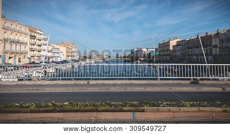 Sete, France - January 4, 2019: Street Atmosphere On The Stone Bridge Near The Marina On A Winter Da