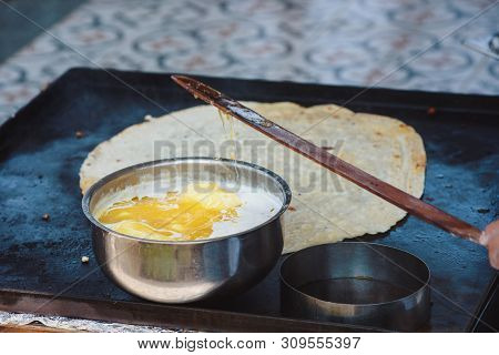 Turkish Woman Prepares Gozleme - Traditional Dish In The Form Of Flatbread Stuffed With Greens And C