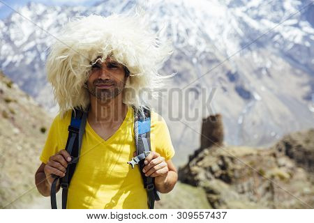 View At Young Hiker With Traditional Papakha Fur Hat At High Latitude Mountains At Mtskheta-mtianeti