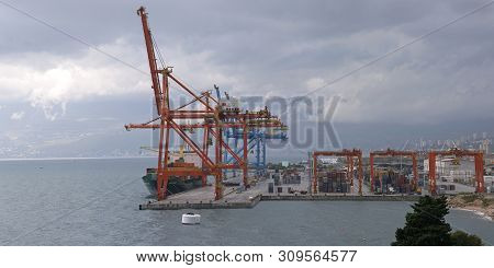 Rijeka, Croatia - October 17, 2014: Cranes Loading Cargo Ship At Adriatic Gate Port In Rijeka, Croat