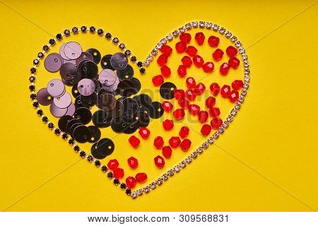 Embroidery Products And Tools. Heart, Rhinestone, Sequin And Red Roundels On A Yellow Background.