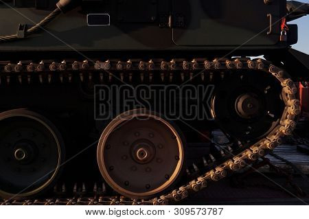 View Of Caterpillar Drive Wheels. A Fragment Of A Caterpillar Military Vehicle.