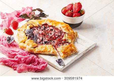 Homemade Strawberry Open Pie Gallet With Purple Basil And Balsamic Dressing On A Light Background.