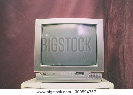 Old Analog Tv With Kinescope On A Brown Background