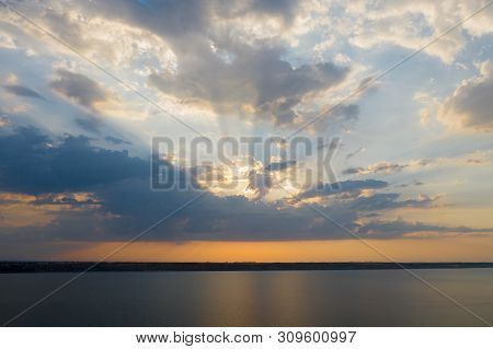 Beautiful Twilight Silhouette Sunset On The Kuyalnik Estuary Near Odessa. Sunset Over The Lake. Even