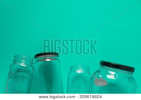 Isolated Glass Jars, Flat On Teal Mint Green Background, Room For Copy Space Top