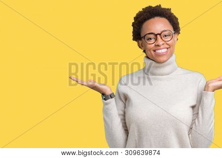 Young beautiful african american woman wearing glasses over isolated background Smiling showing both hands open palms, presenting and advertising comparison and balance