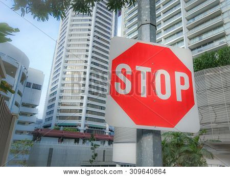 Singapore, March 9, 2018:stop Sign Interaction Hanging On Post Shopping Street At Orchard Road. Sing