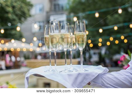 Catering Service Waiter Holding A Tray With Glasses Of Wine Prosecco And Champagne For Tasting