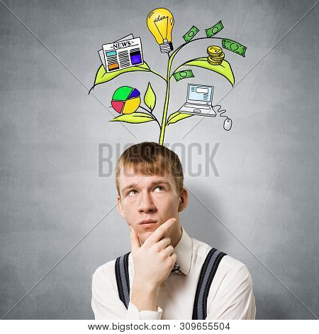 Redhead Student Looks Pensive Upwards And Thinking About Some Genius Idea. Clever Boy With Drawing I