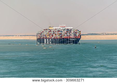 Suez, Egypt - November 5, 2017: An Large Container Vessel Ship Msc Maya Passing Suez Canal In The Sa