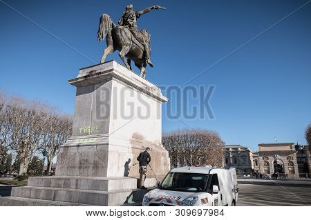 City Employee Who Cleans The Statue Of Louis Xiv In Montpellier, France